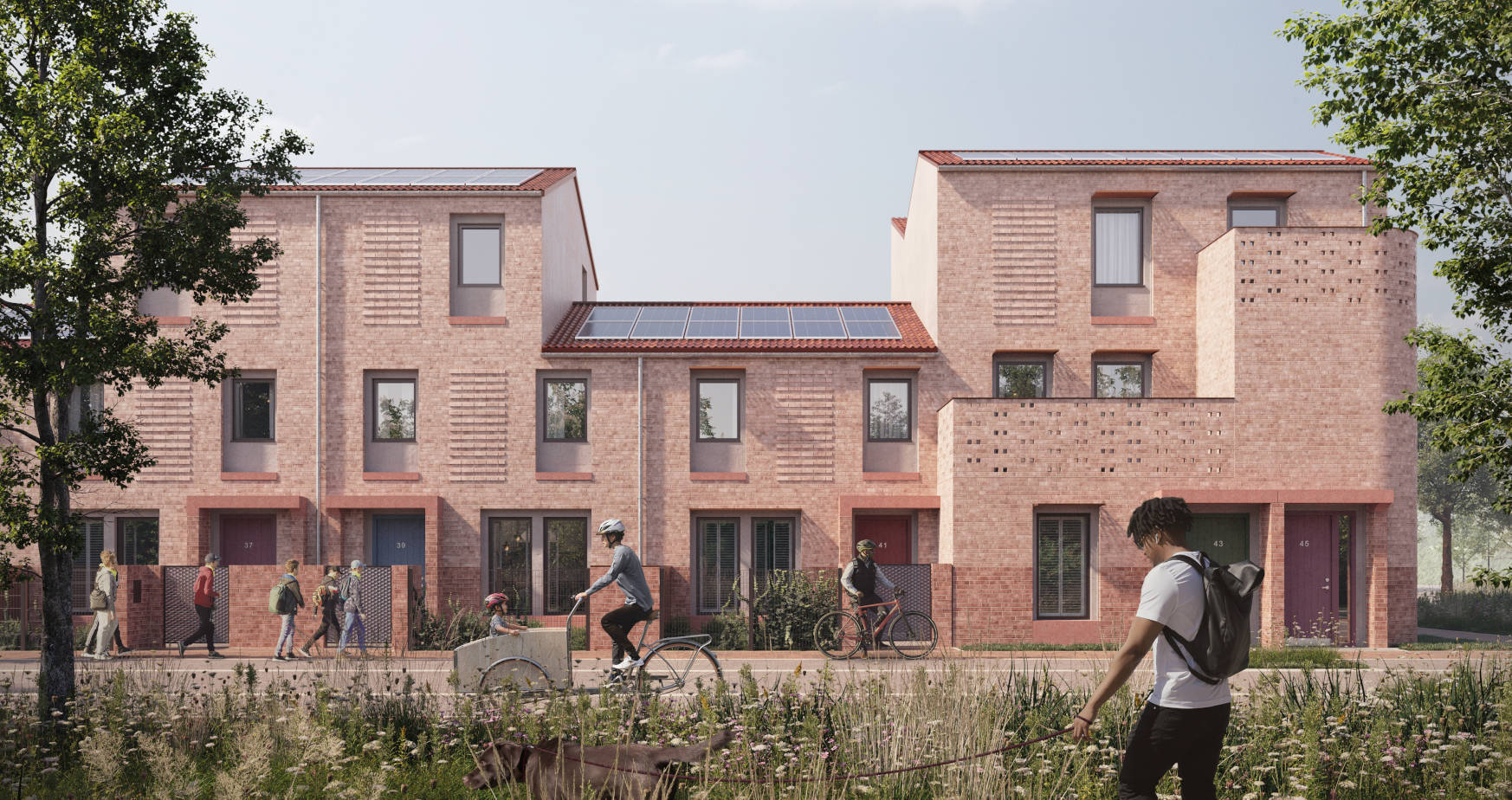 An artists rendering of the Burnholme Green development. The scene shows a row of different style houses, in the foreground is a green space with paths winding through and people walking and cycling.