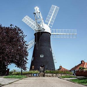 An image of  windmill on a street.